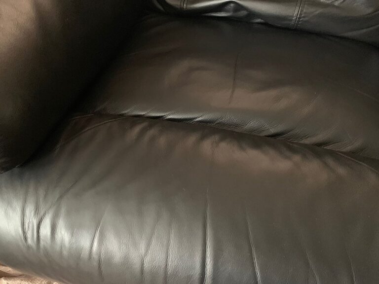 cigarette burn on a leather sofa (after repair by The Leather Expert)
