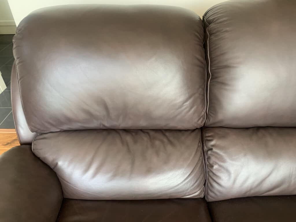 body oils damage a leather sofa (after repair by The Leather Expert)